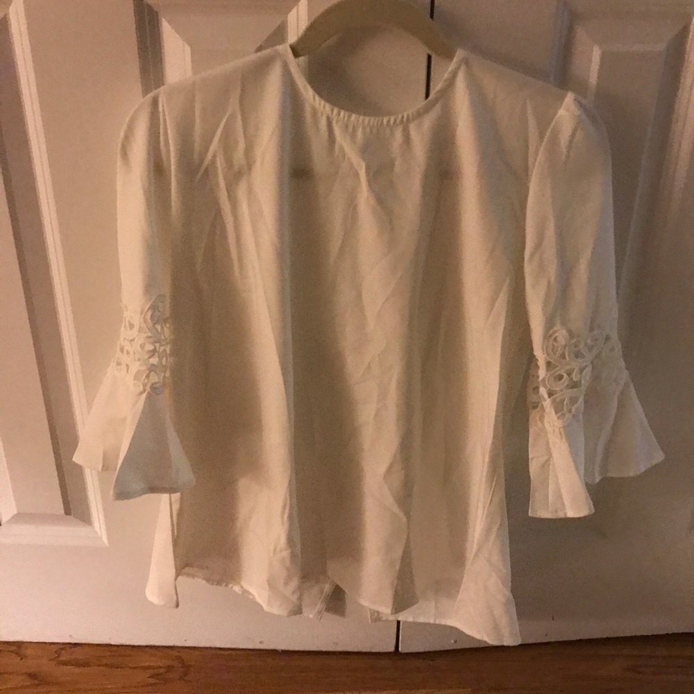 White blouse with crotchet flare sleeve